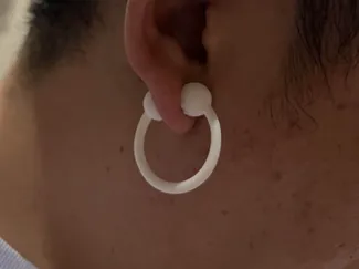 Massaging earrings