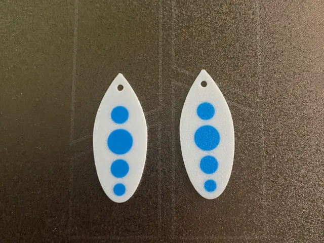white and blue earrings