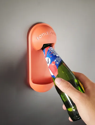 Bottle opener with cap catcher