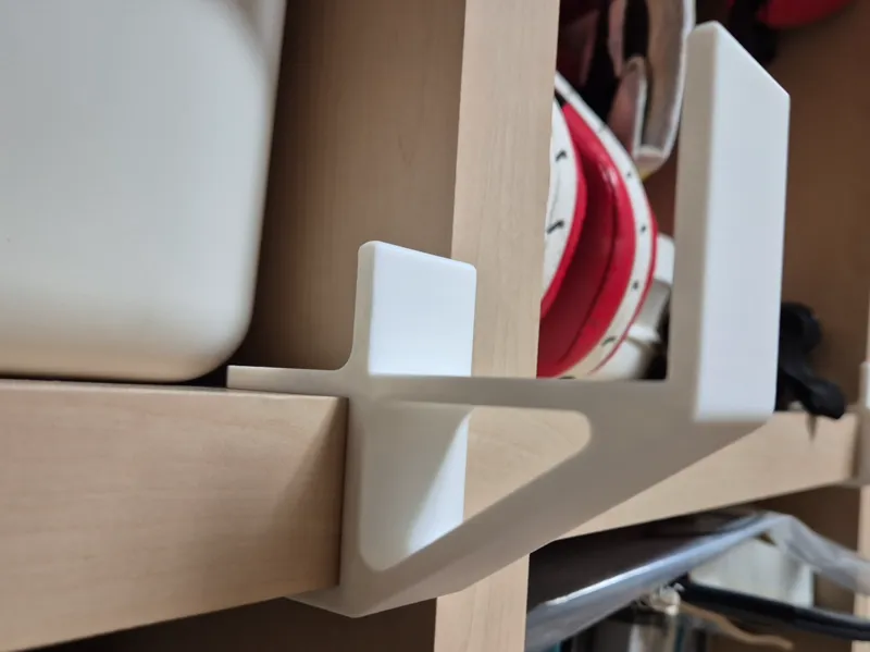 Attach to bookshelves to hold items / Bracket