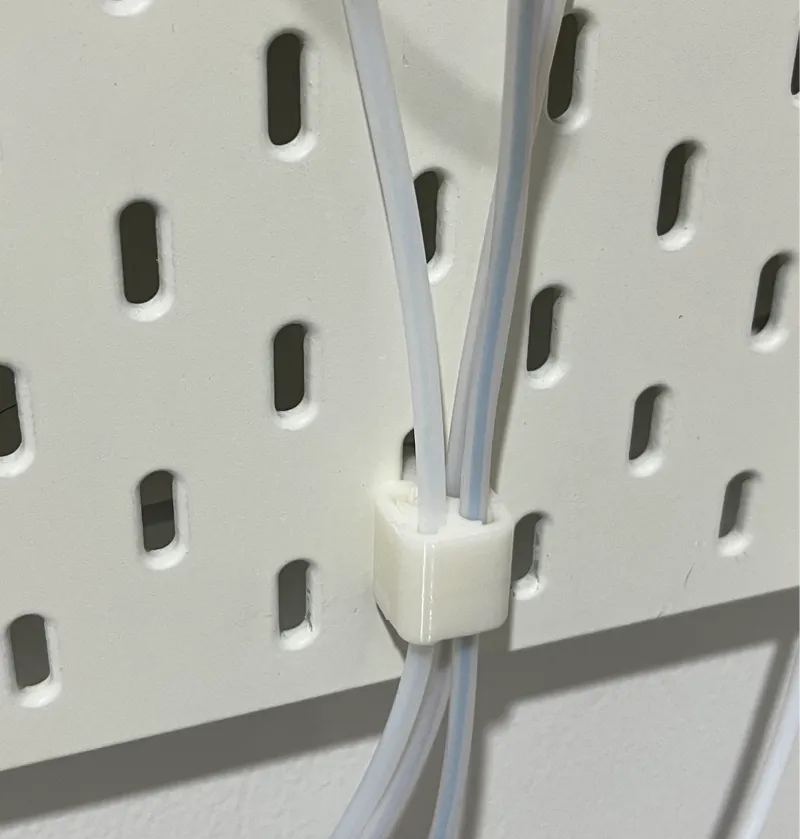 Quick-release PTFE tubes holder for SKÅDIS