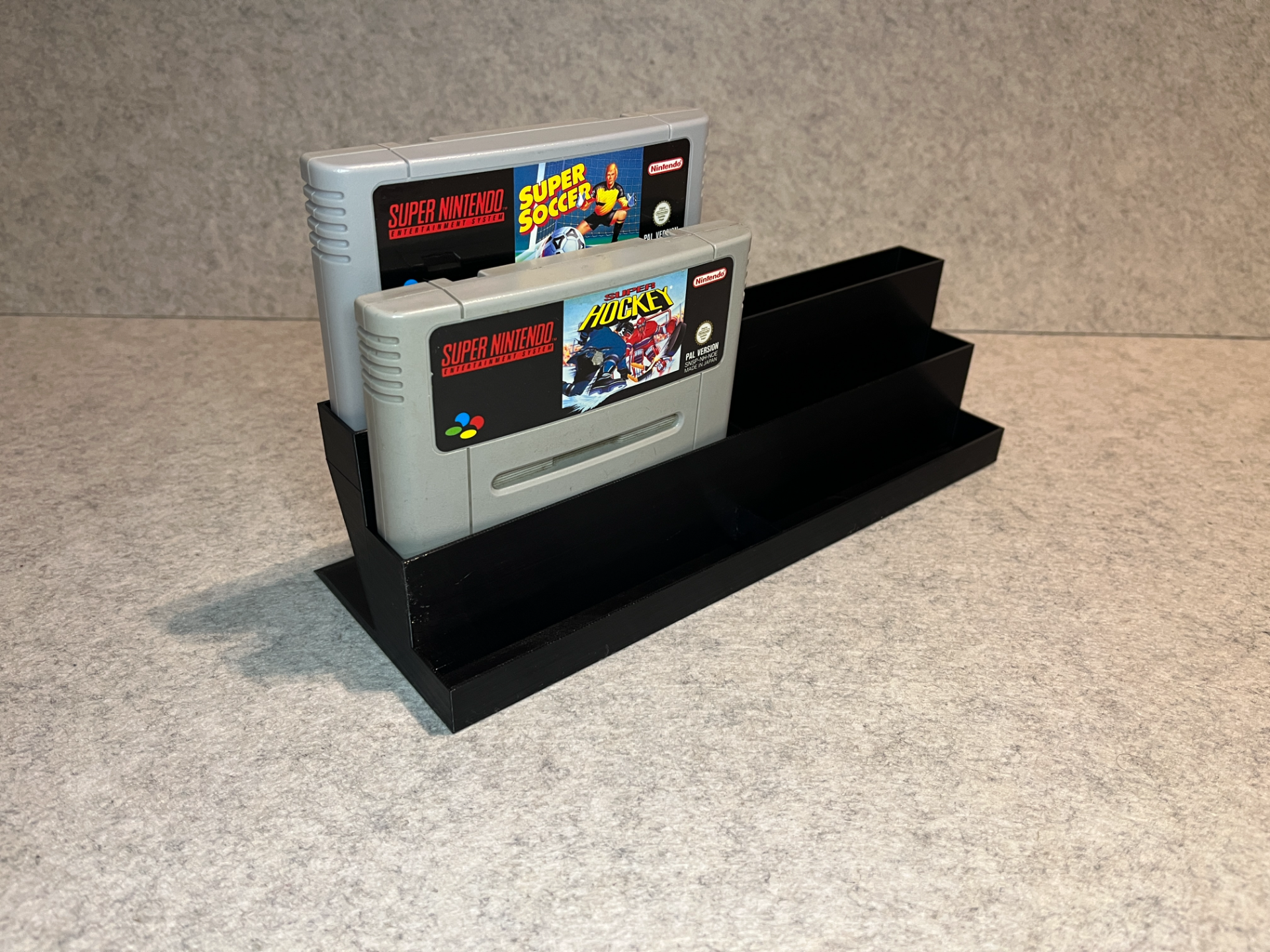 Display stand holder for Super Nintendo SNES games