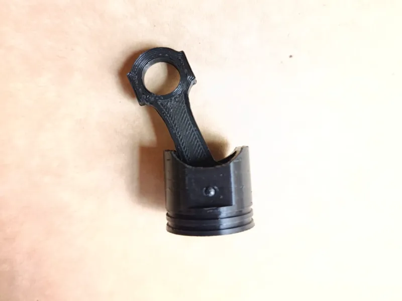 piston articulado llavero