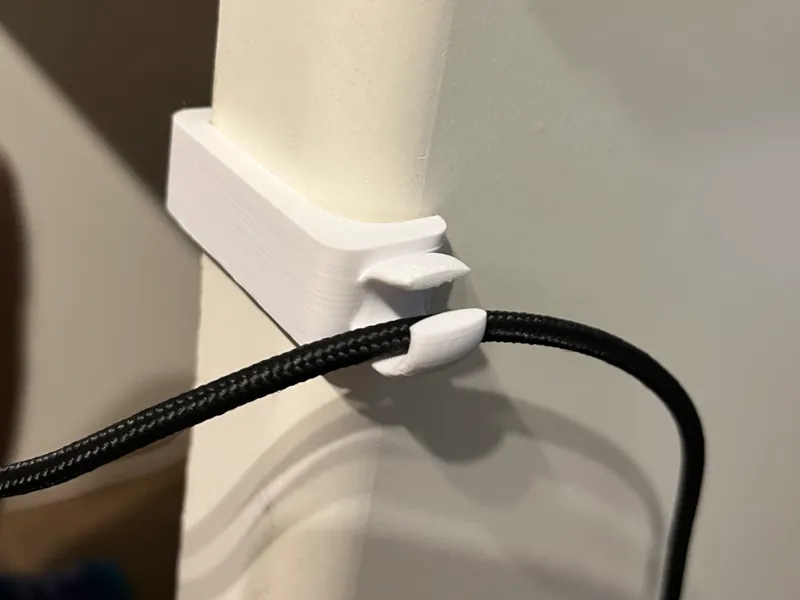 Desk corner cable organiser