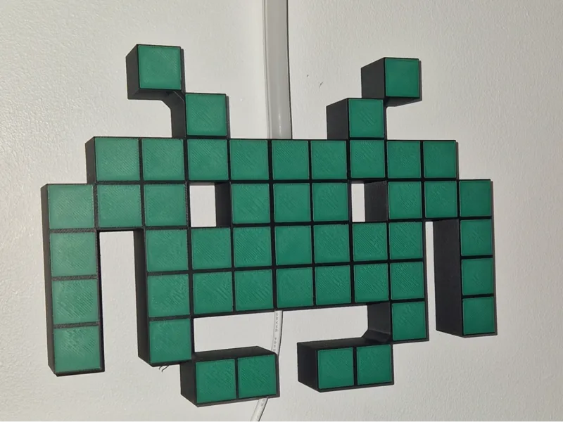 Space invader wall art with neon strip