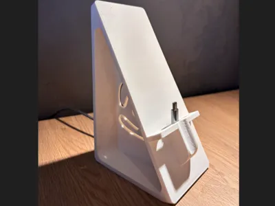 Phone desk stand with charging port and fidget