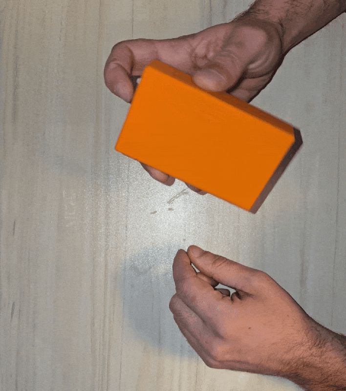 Magnetic storage box with button opening