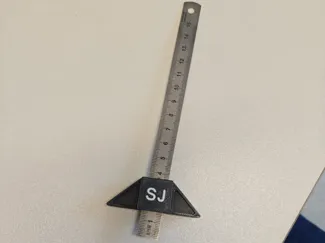 Attachment for metal ruler