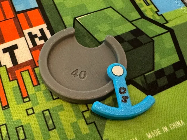 Simple aid for glueing magnets onto bases.