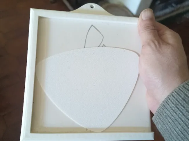 Hangable frame for tiles