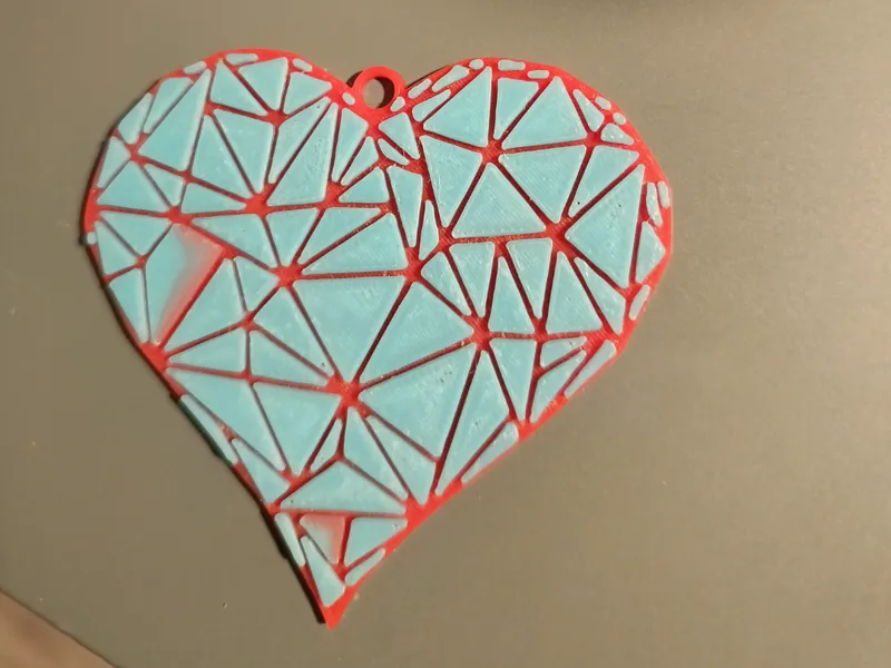 Heart-shaped pendant with triangles AMS 