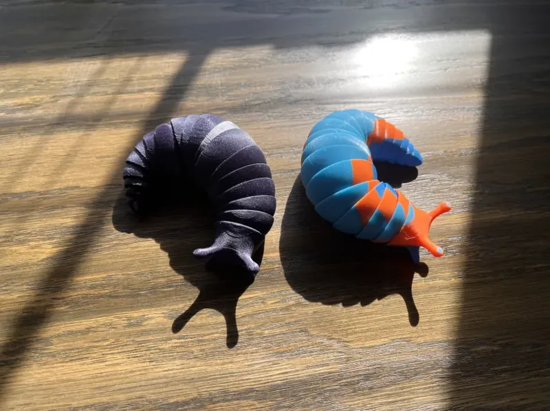 Slug with break away brims
