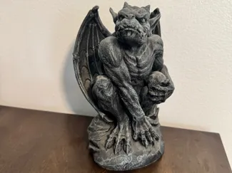 Gargoyle on rock statue