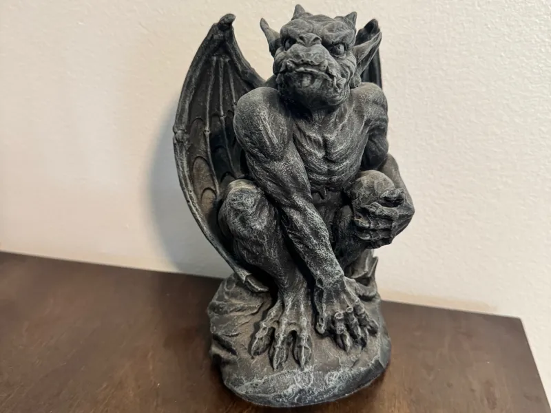 Gargoyle on rock statue