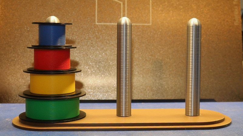 Towers of Hanoi game made of tiny filament spools