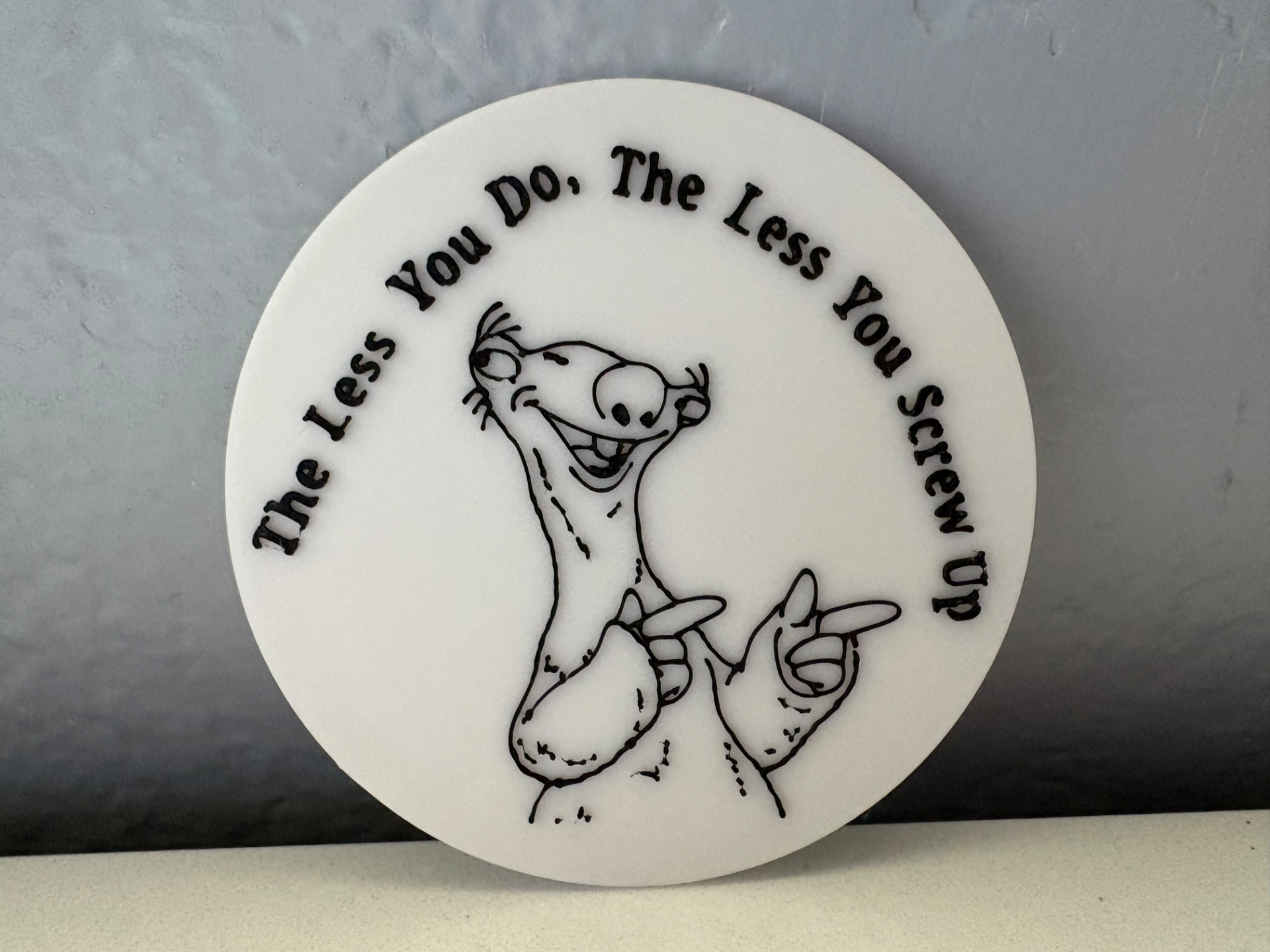"The less you do, the less you screw up" coaster