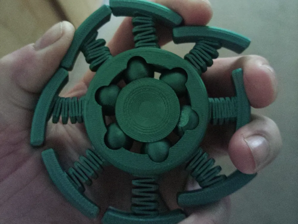 Spring Powered Spinner Springy Spinner by the Town's end MakerWorld: Download Free 3D Models