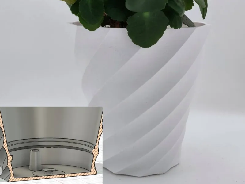 Flower pot with built in reservoir