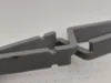 Clamp with notches for elastic