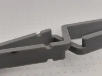 Clamp with notches for elastic