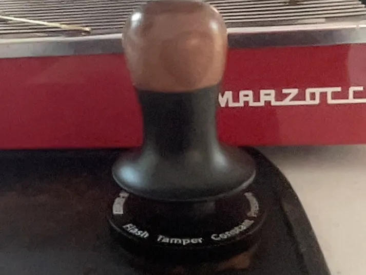 Coffee making tamping station