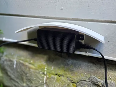 Rain cover roof for power adapter