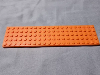 Legos-compatible pinewood derby car