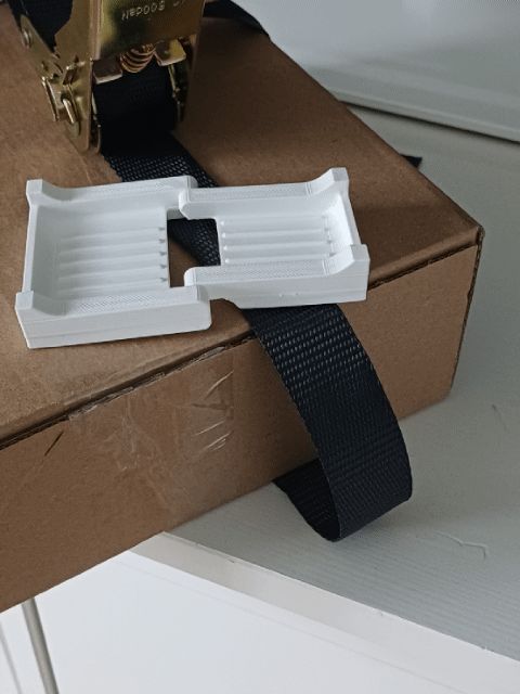 Adjustable corner edge protector for tension strap