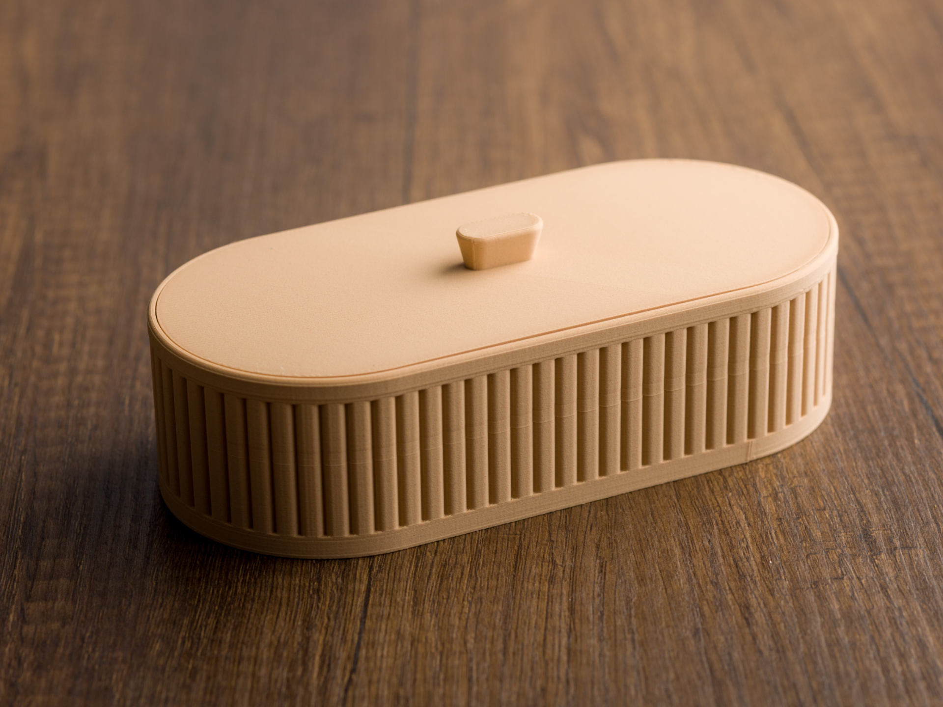 Low ribbed oval box with lid