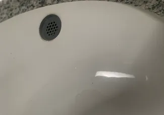 Bathroom sink overflow plug