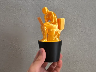 Trophy of the Thinking man on toilet