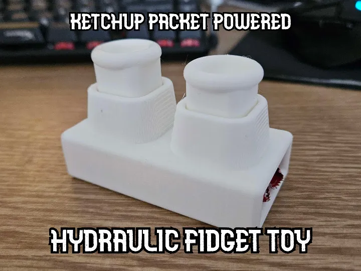 KETCHUP PACKET HYDRAULIC FIDGET TOY