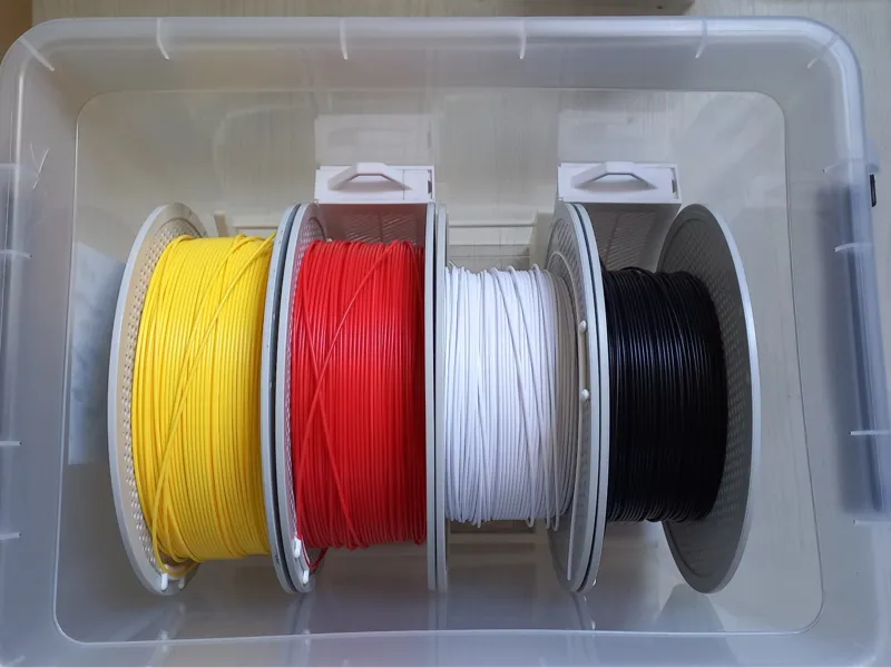 Drybox spool and desiccant holders