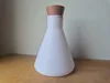 flask and cork on other plates