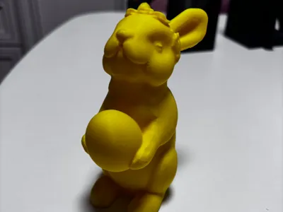 Easter bunny holding an egg