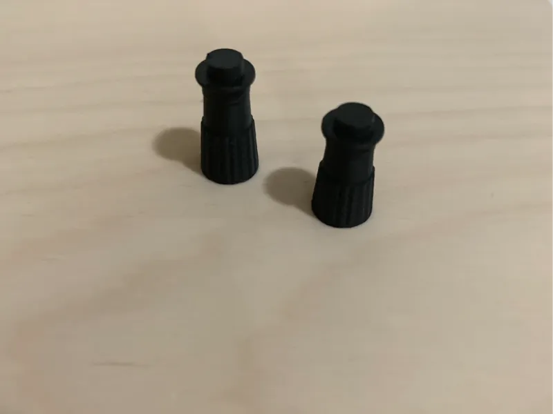 Presta valve cap with 1x1 round tile