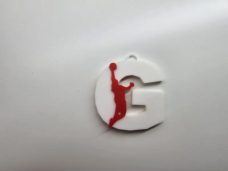 Llavero de baloncesto letra G