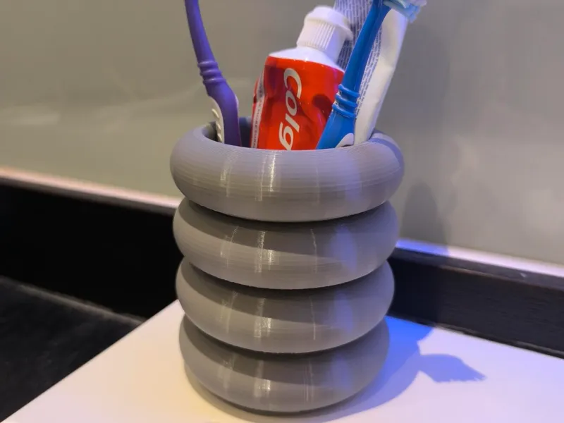 TOOTHBRUSH CUP