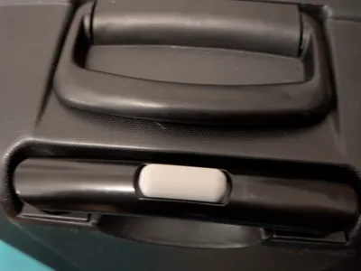 Suitcase button