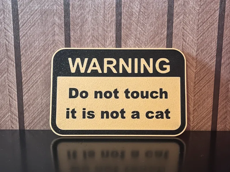 Warning: Do Not Touch – It’s Not a Cat sign
