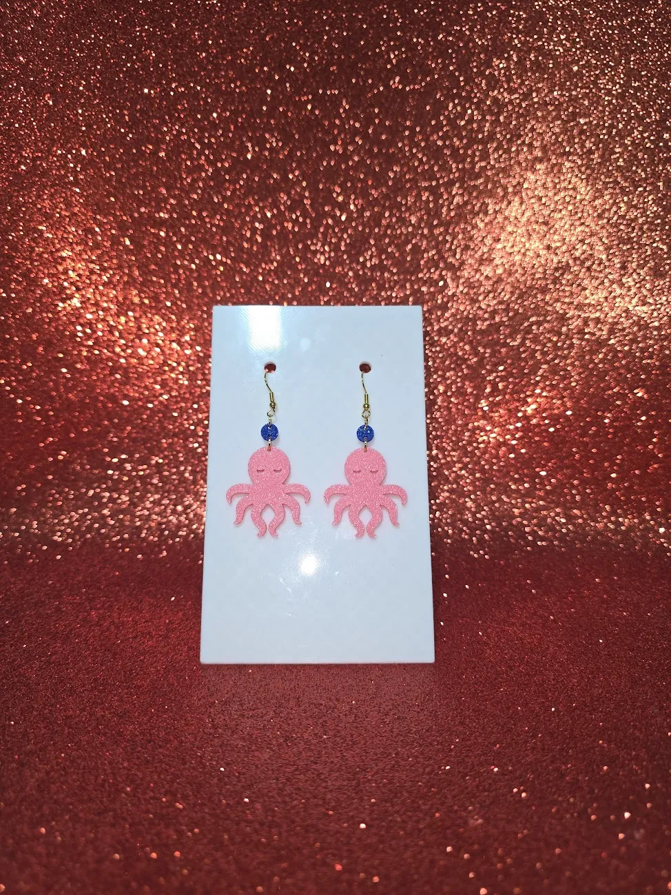 Pink octopus earrings view 2