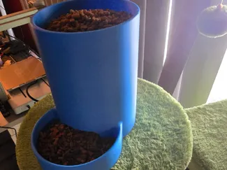Gravity assisted cat feeder dog feeder