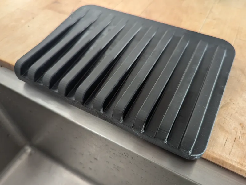 Drip tray for undermounted sink
