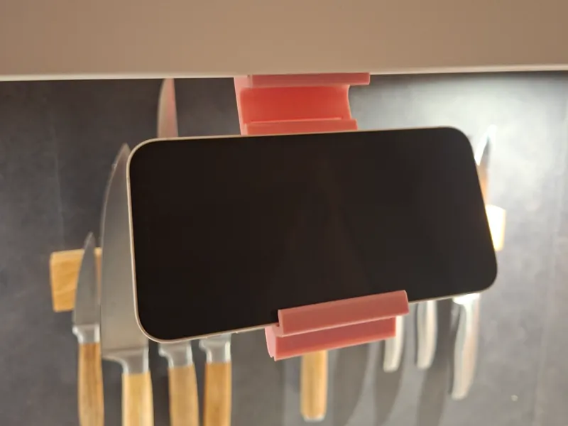 Foldable cabinet phone holder