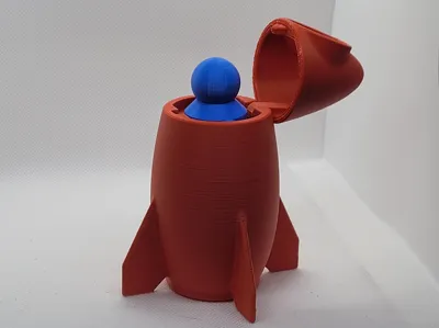 Toy rocket, with flip top and astronaut