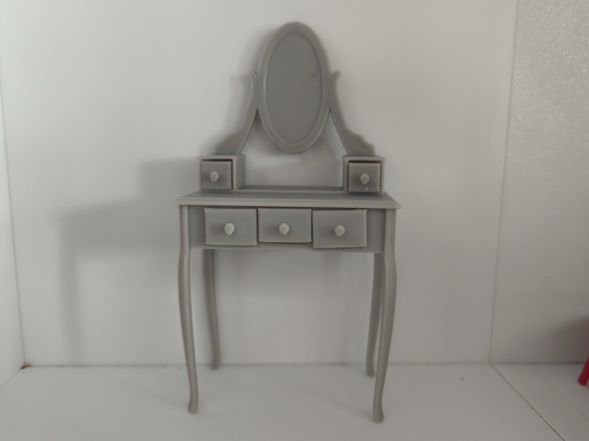 Miniature vanity table for dolls with drawers