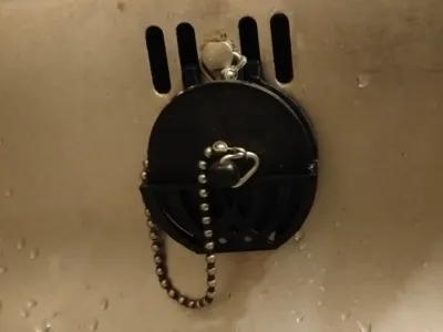 Sink plug holder