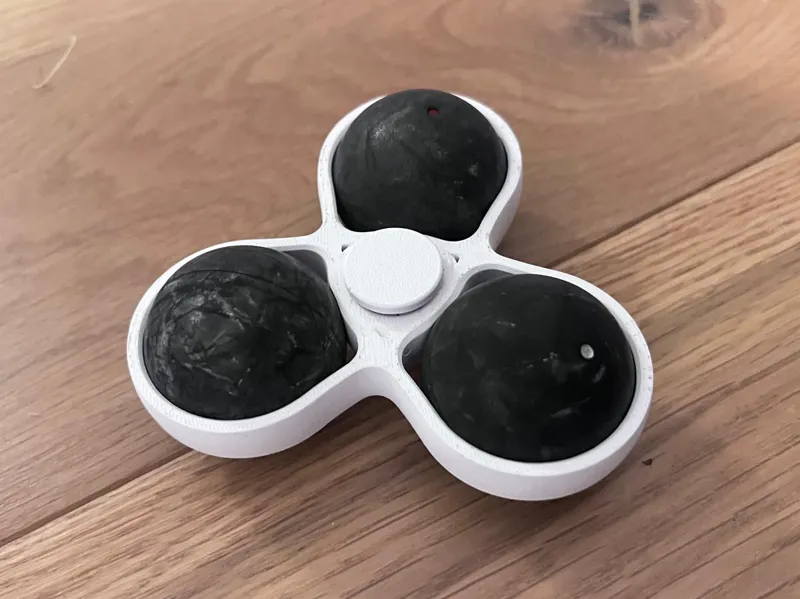 Squash ball holder fidget spinner