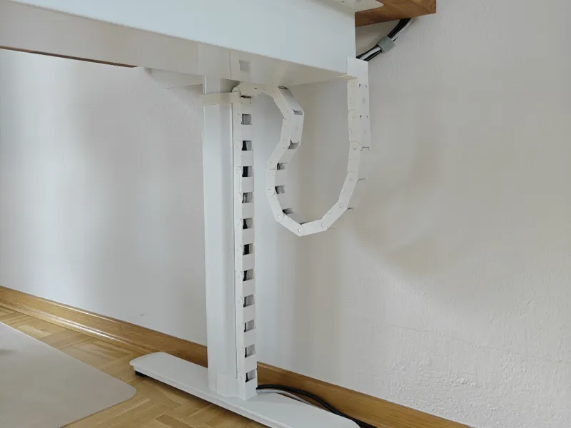 Magnetic standing desk cable chain