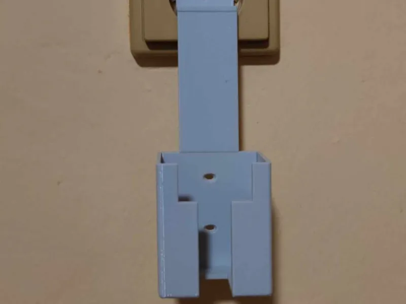 Power brick power outlet holder